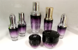 Purple Glass Cosmetic Serum Bottle And Eye Cream Jar
